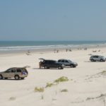 cropped-cars-on-the-beach-2069039_1920.jpg