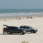 cropped-cars-on-the-beach-2069039_1920-e1549741318762.jpg